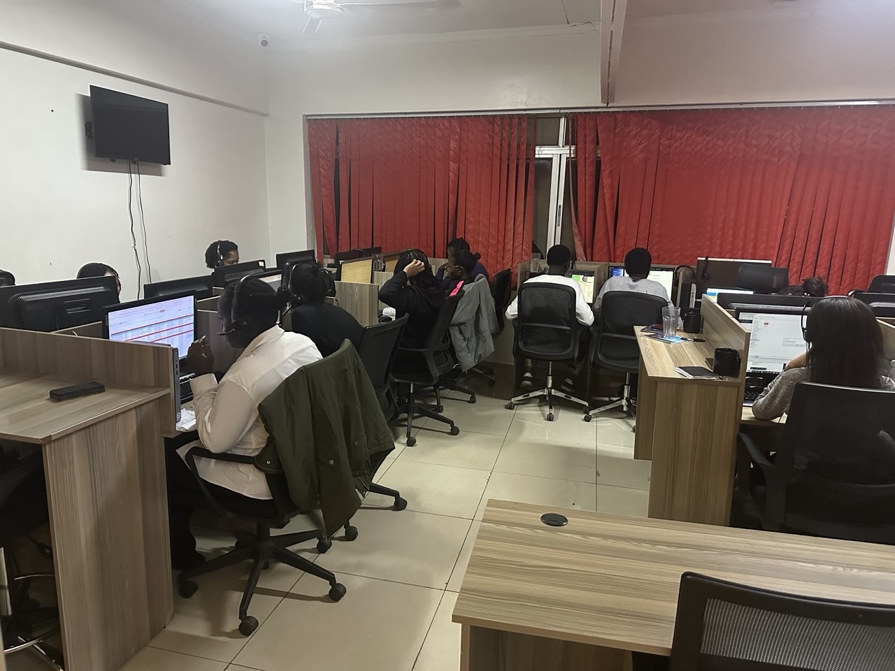 Agents at their workstations on a call center floor in Kenya